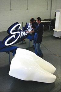 Manufacturing the sign for Smiles