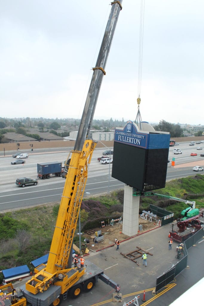 CSUF graphic display sign raised above base for construction